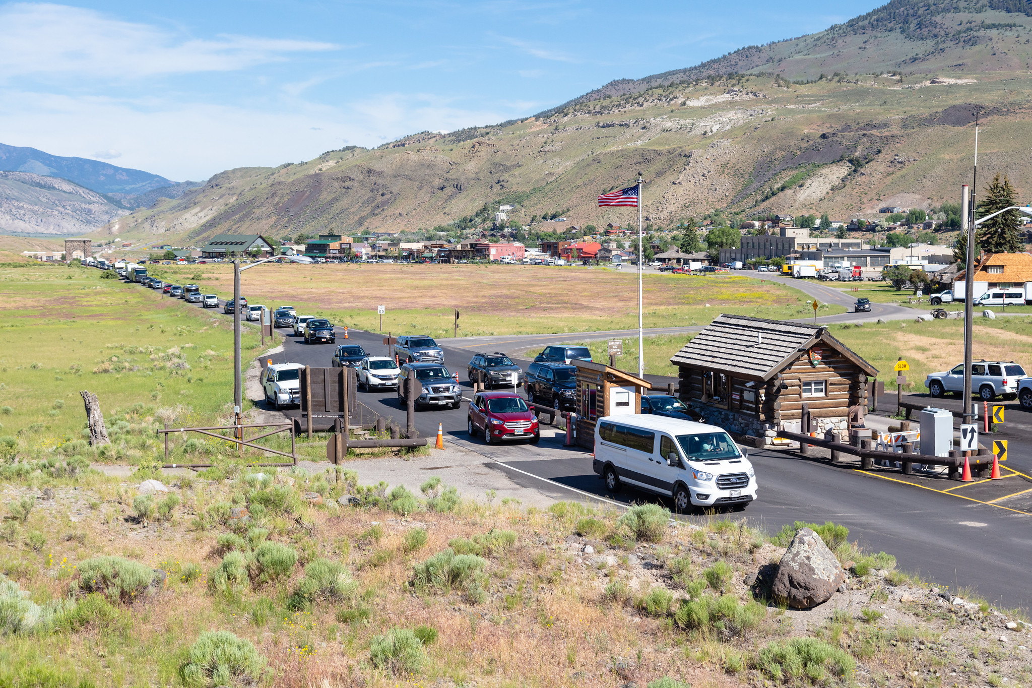 Line of cars waiting to get in at the entrance to Yellowstone