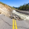 a washed away road near a river