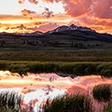 Sunset colors reflected in a pond.