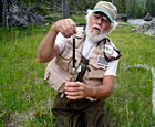A man examines a fish. A man examines a fish.
