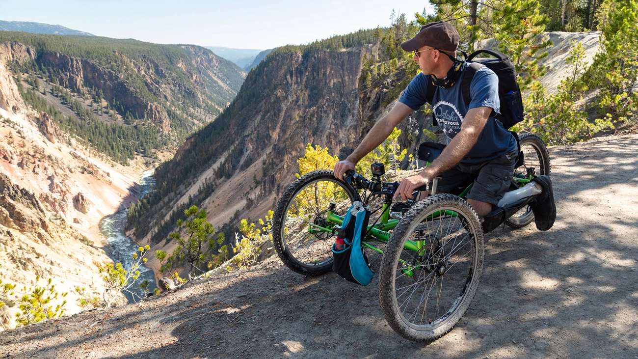 Exploring the Sublime Point Trail with an off-road wheelchair A person in a mobility chair looking at a canyon vista