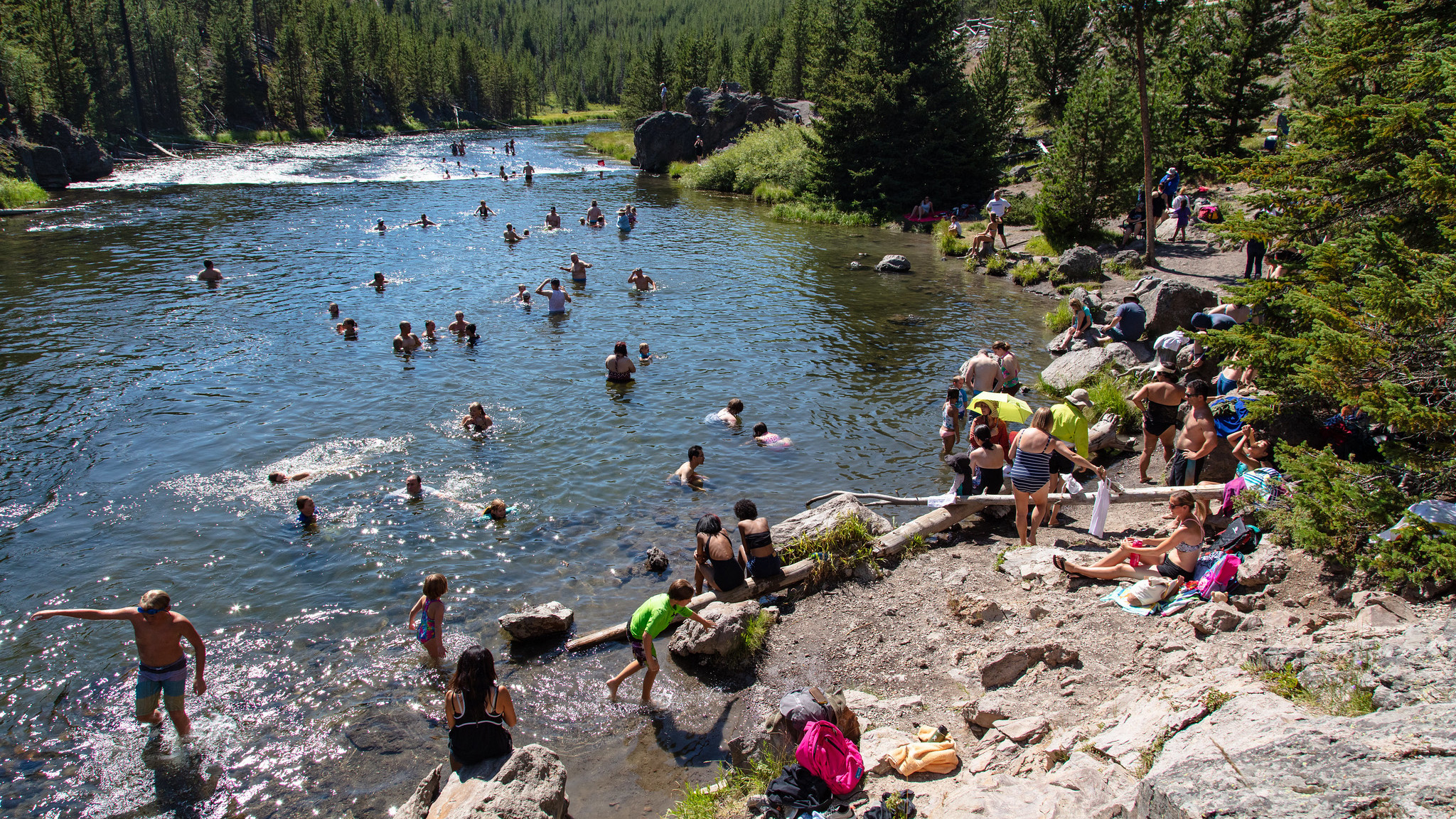 People swimming at Firehole Swim Area