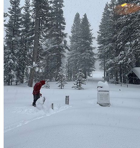 Digging out the 24 hour snow stake, Tuolumne Meadows in December 2022
