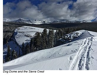 View toward distant snowy peaks as seen from a snowy ridge