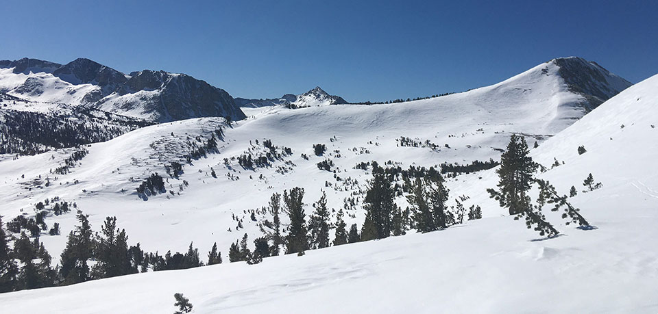 Fletcher, Vogelsang, and Rafferty Peaks left to right on February 28, 2022. Snow covered Fletcher, Vogelsang, and Rafferty Peaks left to right on February 28, 2022.