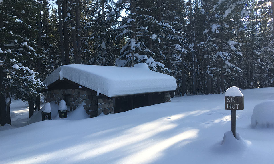 Fresh snow blankets the Tuolumne Meadows Ski Hut on December 14, 2022.