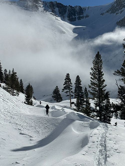 Frozen ocean waves with skiers, Ellery Lake, January 19, 2023. Frozen ocean waves with skiers, Ellery Lake, January 19, 2023.