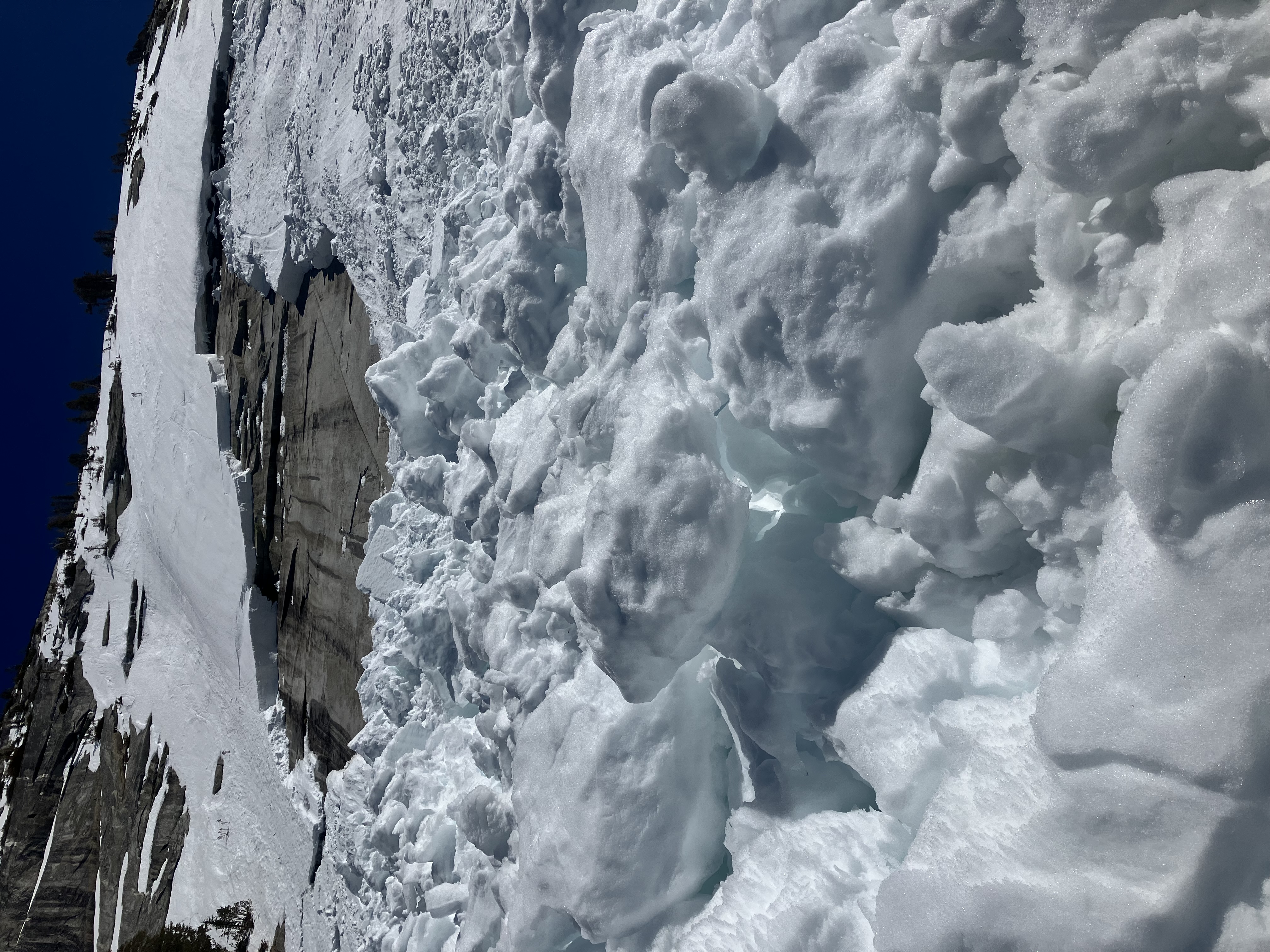 Glide avalanche on Cathedral Peak ridge, April 19, 20225 Looking up a granite ridge showing a glide avalanche