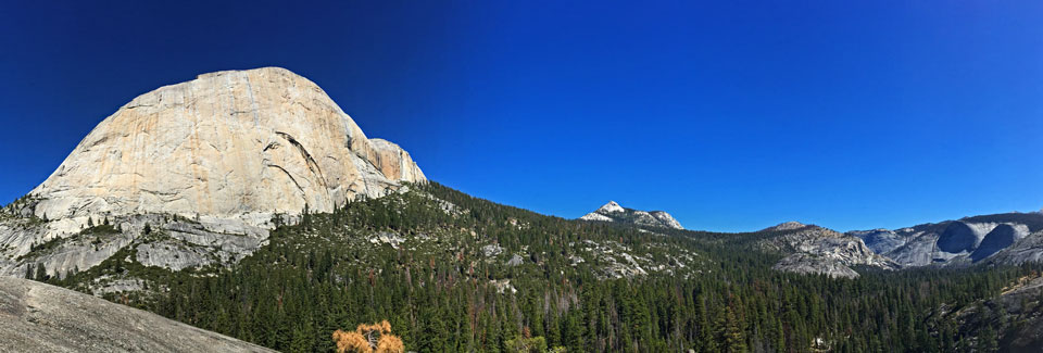Panorama showing Half Dome and the low area south of Half Dome