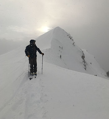 Storm clearing with skier and Lembert Dome on January 16, 2023