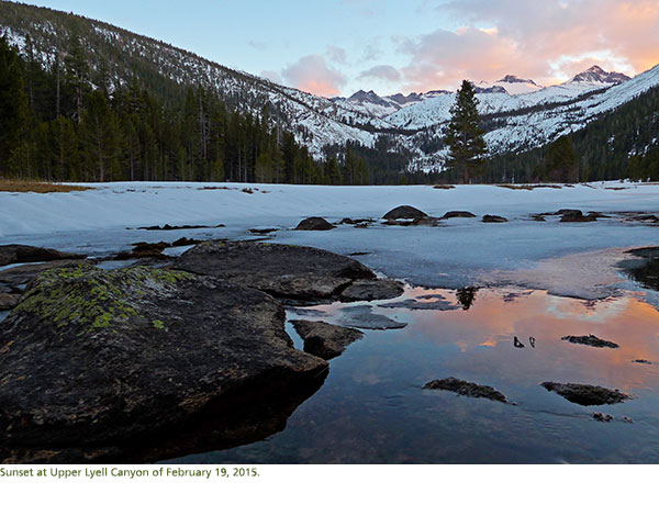 Pink and blue sunset skies reflect in the water in Upper Lyell Canyon.