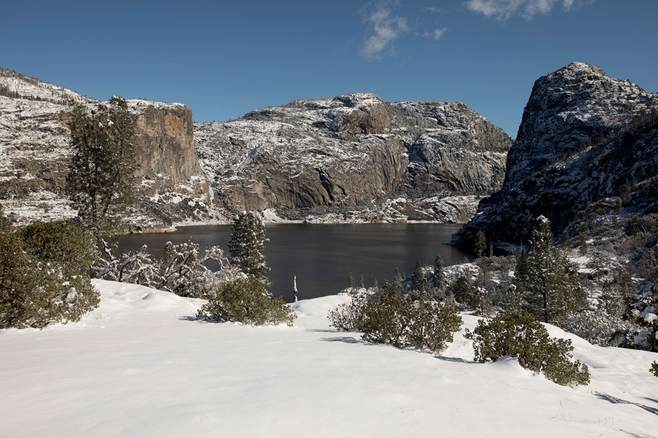 Cliffs and reservoir at Hetch Hetchy covered in snow Cliffs and reservoir at Hetch Hetchy covered in snow