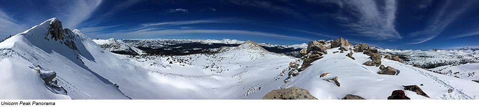 View of snowy mountain peaks in the foreground and in the distance