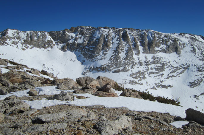 Wind-swept partially snowy ridge