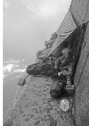 Bivouacing on a ledge in stormy weather