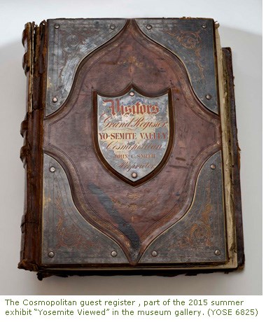 The Cosmopolitan guest register, part of the 2015 summer exhibit “Yosemite Viewed” in the museum gallery. Large historic book with ornate brown cover.