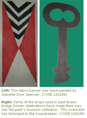 Some of the props used in past Bracebridge Dinner celebrations have made their way into the park’s museum collection. This oversized key belonged to the housekeeper. A fabric banner was hand-painted by Jeanette Dyer Spencer. 