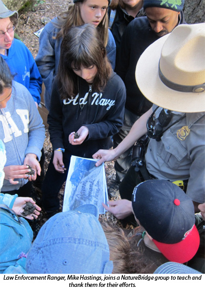 Law Enforcement Ranger, Mike Hastings, joins a NatureBridge group to teach and thank them for their efforts. Law Enforcement Ranger, Mike Hastings, joins a NatureBridge group to teach and thank them for their efforts.