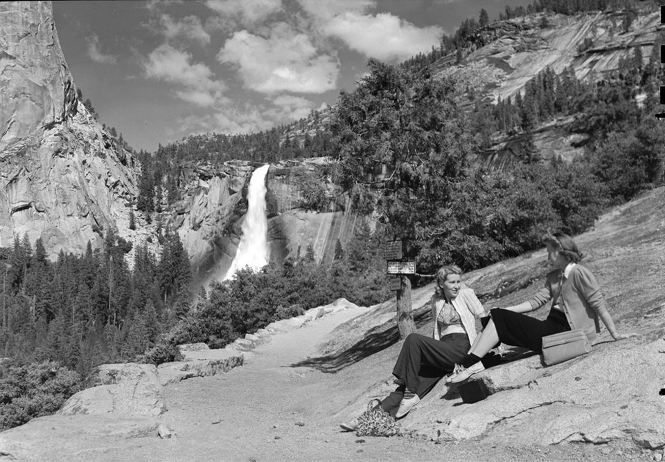 Nevada Fall Women sitting on rock with Nevada Fall in background