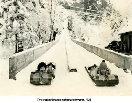 Two women coming down the toboggan run in Yosemite Valley, 1928