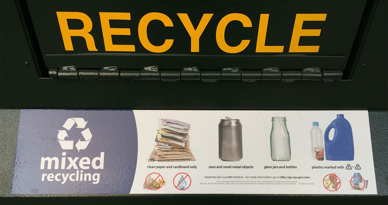 Sign showing mixed recycling can and associated symbols of what is expected in there.
