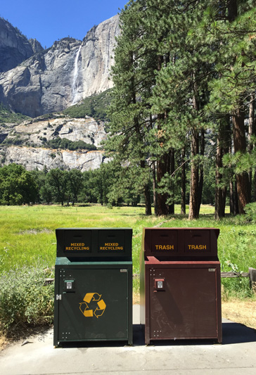New recycling and garbage cans in Yosemite Valley with Yosemite Falls in background