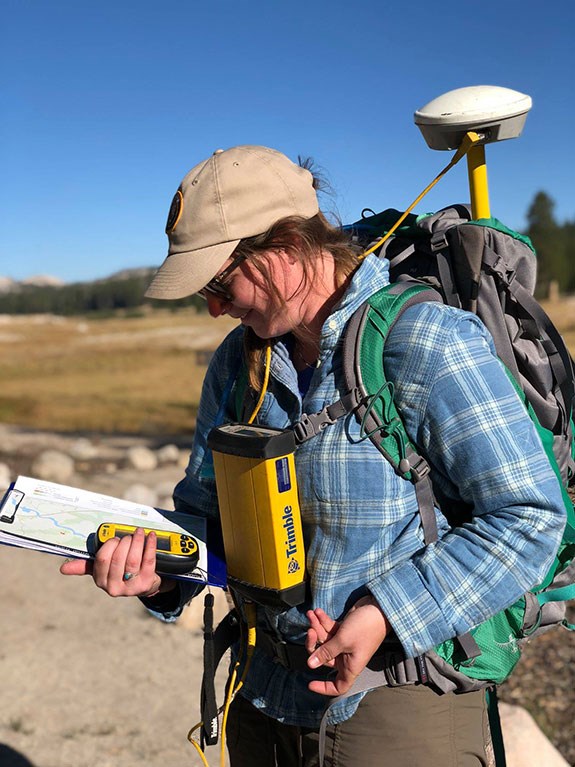 Student Conservation Association intern maps informal trails in Tuolumne Meadows.