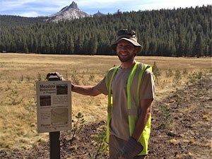 photo of volunteer doing restoration work