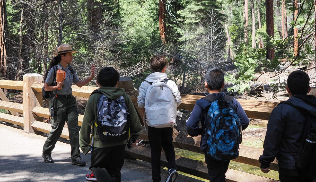 Ranger leading students over Yosemite Creek Bridge Ranger leading students over Yosemite Creek Bridge