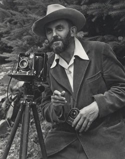 Portrait of Ansel Adams with a camera