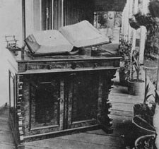 Book sits on stand on a porch