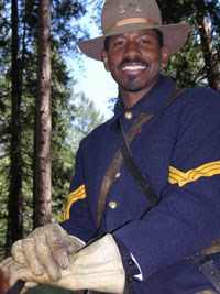 Posed shot of a park ranger dressed as a Buffalo Soldier