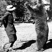 B&W of Enid Michael dancing with bear