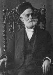 Portrait of Hutchings sitting in a chair