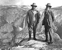 John Muir stands on Overhanging Rock with President Theodore Roosevelt
