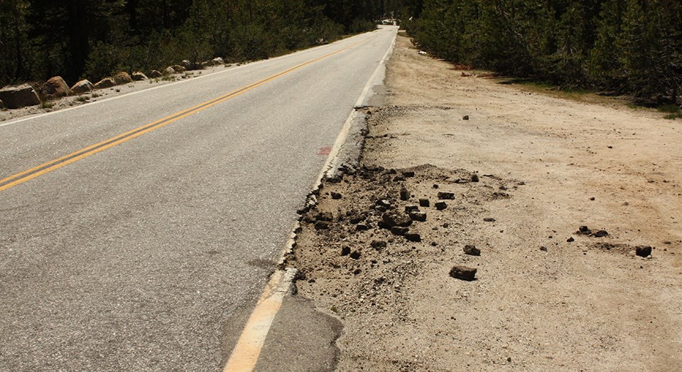 Crumbling asphalt caused by steep grades and off-road parking have caused Tioga Road's shoulders to narrow over the last 40 years.