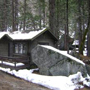 Curry Village cabin next to a very large boulder
