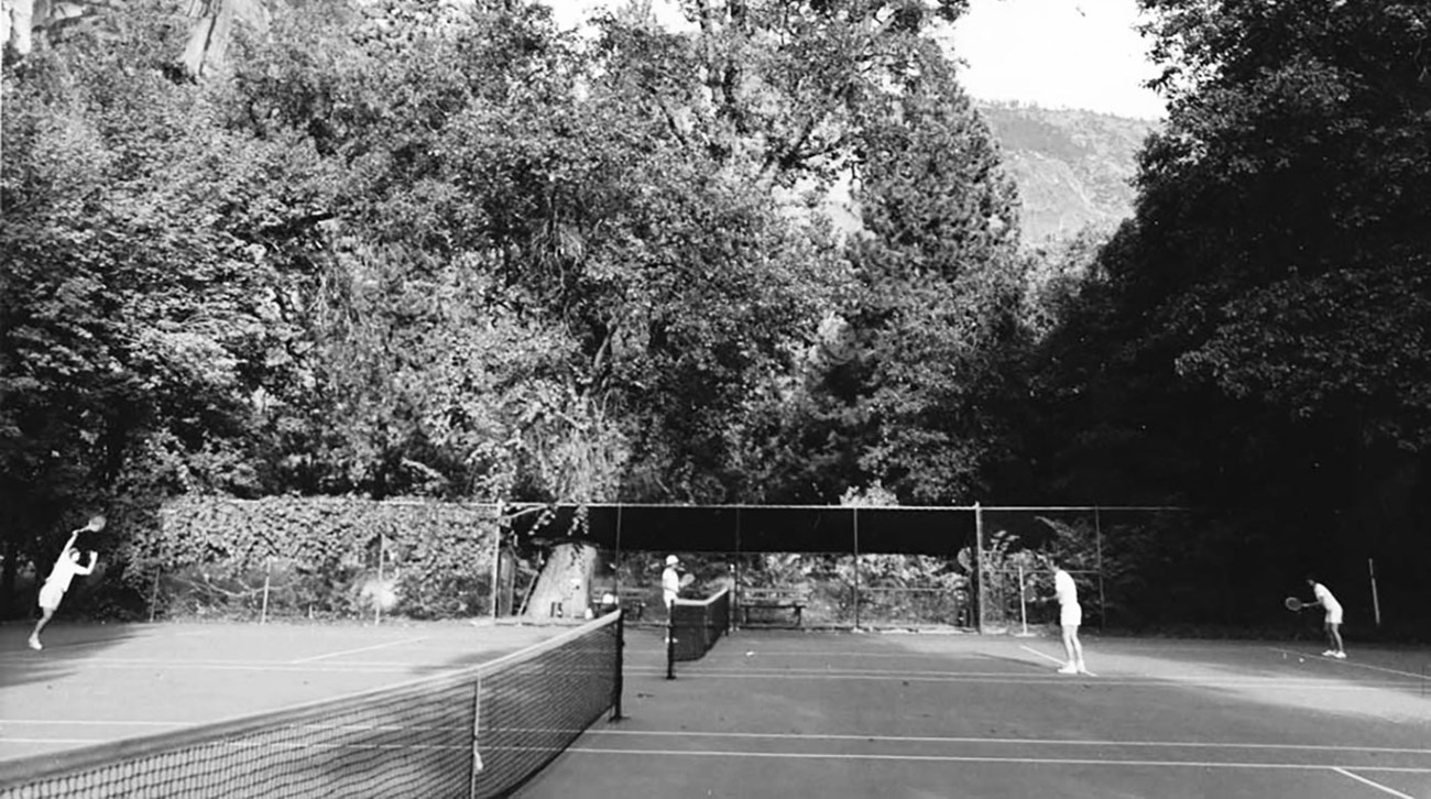 Ahwahnee tennis courts with players in 1970