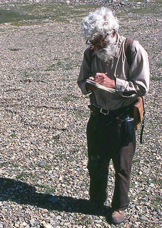 Man writing in a field notebook