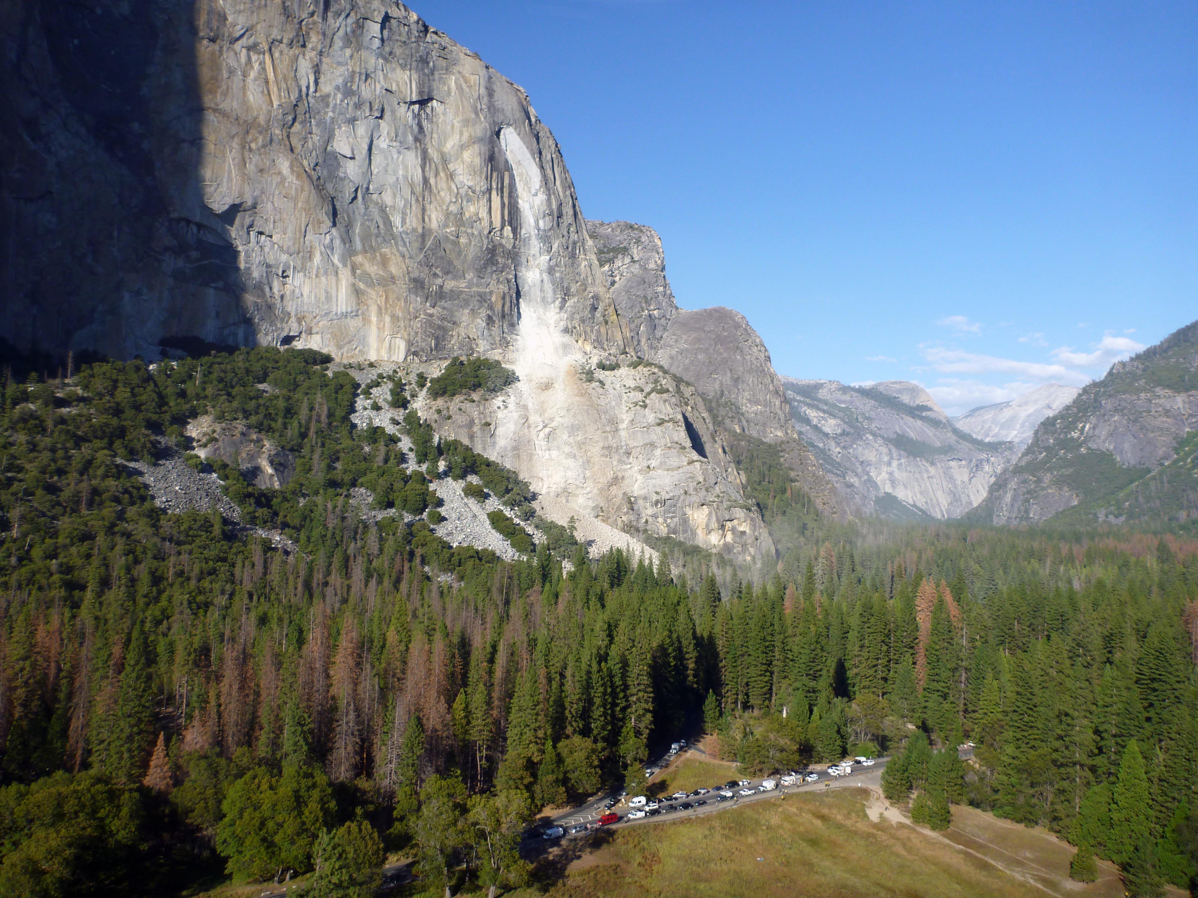 Large rockfall scar on a mountain above the valley floor