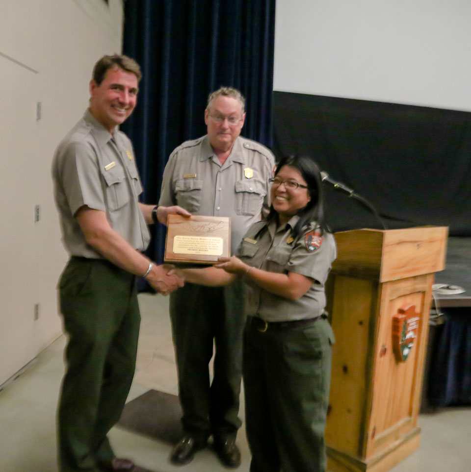 Ranger presenting another ranger with an award