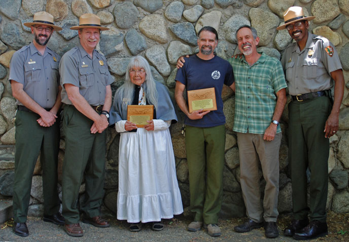 six people posing for a photo