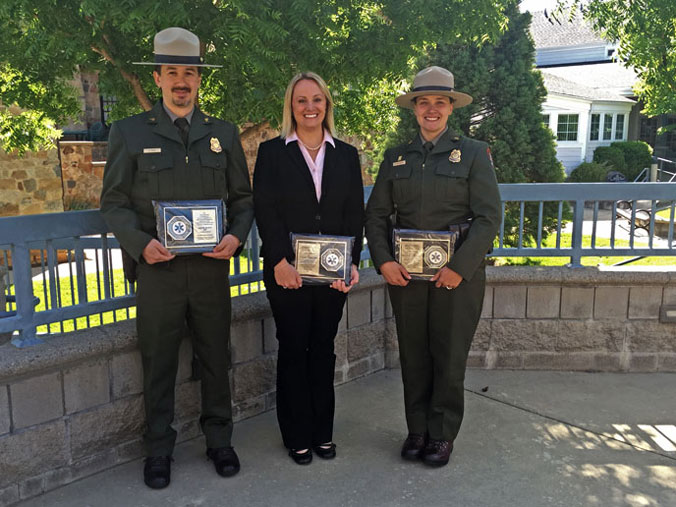 Hahn (left), Phillipe (middle), Schlicting (right) posing with awards