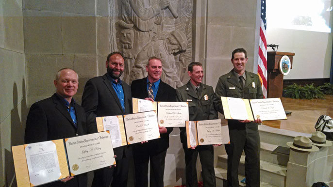 Award winners showing certificates