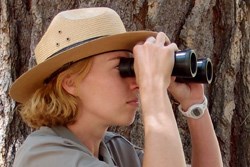 Ranger looking through binoculars