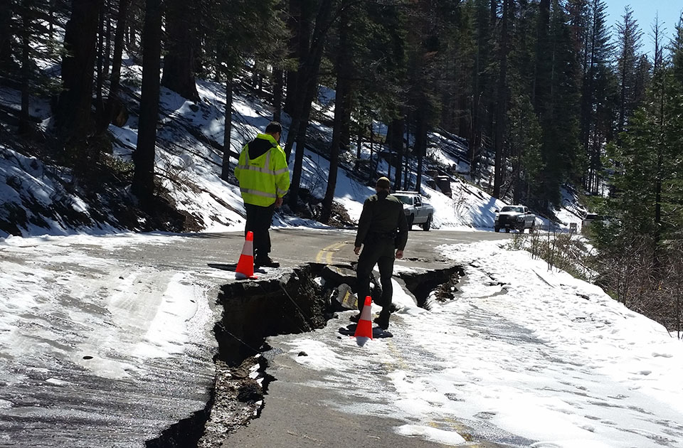 Crews looking at damage along the Big Oak Flat road