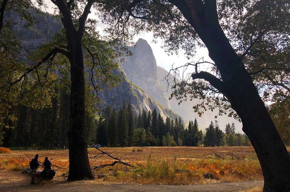 Visitors looking across Cook's Meadow toward Sentinel Rock on October 21, 2019.