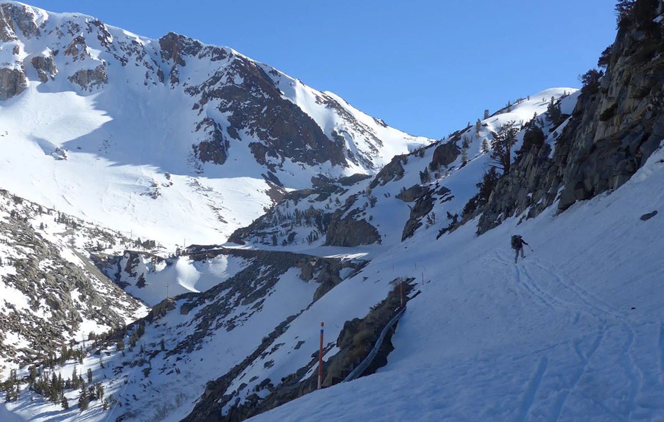Skier along Tioda Road on April 29, 2017 near Green Bridge. There are exposed cliffs below guardrails. Skier along Tioda Road on April 29, 2017 near Green Bridge. There are exposed cliffs below guardrails.