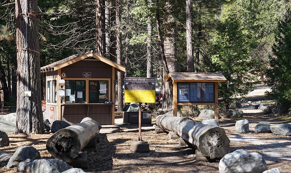Camp 4 Kiosk, small building, and bulletin board