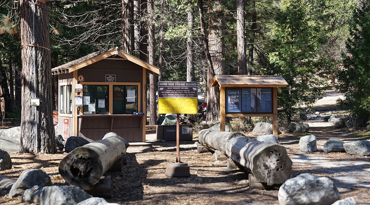 Camp 4 Kiosk, small building, and bulletin board